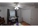 Bright bedroom features a ceiling fan, a window, and a closet at 29524 Waggle Dr, San Antonio, FL 33576