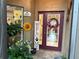 Charming entryway with welcome decor and a decorative front door, inviting visitors at 29524 Waggle Dr, San Antonio, FL 33576
