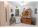 Bright kitchen featuring white cabinets, tile floors, and vintage-style decor at 29524 Waggle Dr, San Antonio, FL 33576