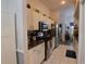 The kitchen features stainless steel appliances and white cabinets at 29524 Waggle Dr, San Antonio, FL 33576