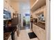 The kitchen features stainless steel appliances, white cabinets and an open design at 29524 Waggle Dr, San Antonio, FL 33576