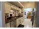 Well-lit kitchen features stainless steel appliances, granite counters, and a convenient breakfast bar at 29524 Waggle Dr, San Antonio, FL 33576