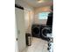 Well-equipped laundry room with modern appliances, and ample storage space at 29524 Waggle Dr, San Antonio, FL 33576