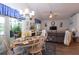 Open-concept living room and dining area with sliding glass doors to lanai at 29524 Waggle Dr, San Antonio, FL 33576