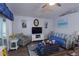 Comfortable living room featuring stylish decor, a ceiling fan, and a calming atmosphere at 29524 Waggle Dr, San Antonio, FL 33576