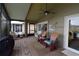 Relaxing screened patio with ceiling fan and comfortable seating, perfect for enjoying the outdoors at 29524 Waggle Dr, San Antonio, FL 33576