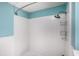 Bathroom featuring white tiled walls and a stainless-steel shower head at 36251 Horseshoe Dr, Zephyrhills, FL 33541