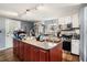 Well-equipped kitchen featuring a center island, modern appliances, and ample countertop space at 36251 Horseshoe Dr, Zephyrhills, FL 33541
