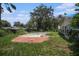 Pool with steps, patio, and an overgrown backyard at 36251 Horseshoe Dr, Zephyrhills, FL 33541