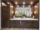 Large bathroom featuring a vanity with double sinks and custom cabinets at 4525 W Swann Ave, Tampa, FL 33609
