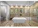 Modern bathroom with a soaking tub, tile floors, and a walk-in shower at 4525 W Swann Ave, Tampa, FL 33609