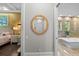 Elegant bathroom showcasing a soaking tub and entrance to the main bedroom at 4525 W Swann Ave, Tampa, FL 33609
