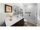 Modern bathroom featuring a glass-enclosed shower, and a decorative mirror at 4525 W Swann Ave, Tampa, FL 33609