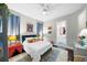 Cozy bedroom with a plush bed, colorful accents, and ample natural light at 4525 W Swann Ave, Tampa, FL 33609