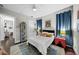 Comfortable bedroom features a stylish rug, and bright blue accents at 4525 W Swann Ave, Tampa, FL 33609