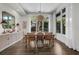 Dining room with modern lighting fixture, large windows, and decorative furnishings at 4525 W Swann Ave, Tampa, FL 33609
