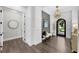 Elegant entryway featuring modern lighting, stylish decor, and hardwood floors at 4525 W Swann Ave, Tampa, FL 33609