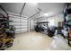 Spacious garage with ample storage featuring a golf cart at 4525 W Swann Ave, Tampa, FL 33609