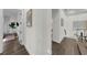 Hallway featuring wood floors and neutral walls, bright and airy at 4525 W Swann Ave, Tampa, FL 33609