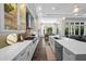 Spacious kitchen with stainless appliances, custom cabinets, and an island overlooking the dining area at 4525 W Swann Ave, Tampa, FL 33609