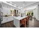 Bright kitchen with modern appliances, quartz countertops, and adjacent dining area with backyard views at 4525 W Swann Ave, Tampa, FL 33609
