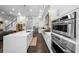 Well-equipped kitchen featuring stainless steel ovens, a center island, and ample counter space at 4525 W Swann Ave, Tampa, FL 33609