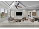 Spacious living room with coffered ceilings, modern furnishings, and large windows at 4525 W Swann Ave, Tampa, FL 33609