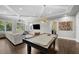 Open living space featuring a pool table, comfortable seating, and large windows for ample natural light at 4525 W Swann Ave, Tampa, FL 33609