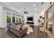 Bright and airy living room with seamless access to a pool area, a media center, and stylish decor at 4525 W Swann Ave, Tampa, FL 33609