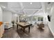 Spacious living room with coffered ceiling, pool table, wet bar, and ample seating at 4525 W Swann Ave, Tampa, FL 33609
