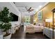 Spacious main bedroom with a ceiling fan, wood floors, and a view of the pool at 4525 W Swann Ave, Tampa, FL 33609