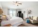 Comfortable bedroom featuring a ceiling fan, large bed and relaxing decor at 4738 Bloom Dr, Plant City, FL 33566