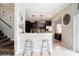Open concept kitchen with dark cabinetry, breakfast bar and a view of living area at 4738 Bloom Dr, Plant City, FL 33566