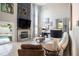 Living room with fireplace, large windows, high ceilings, and neutral furniture at 4738 Bloom Dr, Plant City, FL 33566