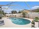 Screened-in pool and patio are surrounded by mature landscaping creating a private backyard retreat at 4738 Bloom Dr, Plant City, FL 33566