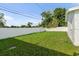 Spacious backyard with a well-maintained lawn and privacy fence at 4741 76Th N Ave, Pinellas Park, FL 33781