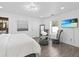 The main bedroom features a plush bed, an accent chair and a flat screen television at 4741 76Th N Ave, Pinellas Park, FL 33781