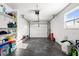 Organized garage with storage shelves and a clean epoxy floor at 4741 76Th N Ave, Pinellas Park, FL 33781