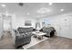 Elegant living room featuring plush velvet sofas, modern lighting, and a bright, open space at 4741 76Th N Ave, Pinellas Park, FL 33781