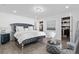 Spacious main bedroom features plush bed, accent furnishings, and natural light at 4741 76Th N Ave, Pinellas Park, FL 33781