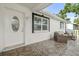 Inviting front porch with stylish outdoor seating and decorative tile flooring for relaxing outdoors at 4741 76Th N Ave, Pinellas Park, FL 33781