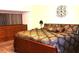 Bedroom with wooden bed frame and nightstand at 4811 Puritan Cir # 4811, Tampa, FL 33617