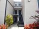 Exterior view of condo building with black stairs leading to the entrances at 4811 Puritan Cir # 4811, Tampa, FL 33617
