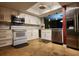 Well-lit kitchen with modern appliances, white cabinets, and updated countertops at 4811 Puritan Cir # 4811, Tampa, FL 33617