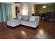 Living room view featuring hardwood floors, comfortable sofa, and stylish decor at 4811 Puritan Cir # 4811, Tampa, FL 33617