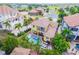 Expansive aerial view showcases the pool, spa, and backyard of the property surrounded by lush landscaping at 539 Treviso Dr, Apollo Beach, FL 33572