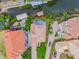 Aerial view of the property and neighborhood showcasing a home with a tile roof and manicured landscaping at 539 Treviso Dr, Apollo Beach, FL 33572