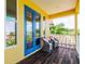 Balcony with chairs and scenic views, offering a relaxing outdoor space with wood floors at 539 Treviso Dr, Apollo Beach, FL 33572