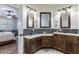 Bathroom showcasing double sink vanities with stylish dark wood cabinets at 539 Treviso Dr, Apollo Beach, FL 33572
