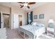 Cozy bedroom featuring a window, ceiling fan and en-suite bathroom at 539 Treviso Dr, Apollo Beach, FL 33572